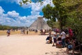 Tourists next to the Pyramid of Kukulkan at Chichen Itza in Mexico
