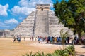 Tourists next to the Pyramid of Kukulkan at Chichen Itza in Mexico Royalty Free Stock Photo