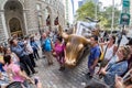 Tourists next to the Wall Street Bull sculpture in New York City Royalty Free Stock Photo
