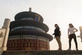 Tourists observe architectural details of China Temple of Heaven complex Royalty Free Stock Photo