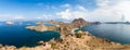 Tourists observing the Panoramic view from the top of Padar Island in Komodo National park, Lubuan Bajo, Indonesia Royalty Free Stock Photo