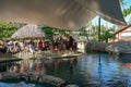 Tourists observing turtles in big tank at The Project Tamar