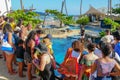 Tourists observing turtles in big tank at The Project Tamar