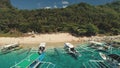 Tourists ocean cruise aerial: passenger boats at harbor of sea bay. Philippines tropic resort, beach