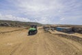 Tourists on off-road cars passing by abandoned house on rock desert road of Aruba Royalty Free Stock Photo