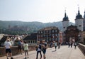 Tourists at an old bridge in the city Heidelberg in Germany