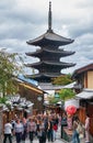 Tourists on the old Higashiyama street with the Hokan-ji Temple on the background. Kyoto. Japan
