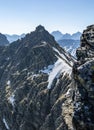 Tourists on the Orla Perc Eagle`s Path, Orlia prt trail in the Tatra Mountains in Poland. Royalty Free Stock Photo