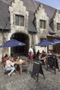 Tourists at outdoor cafe in centre of the medieval town Ghent in Royalty Free Stock Photo