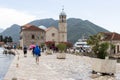 Tourists are overseeing the island of Gospa od Skrpjela Our Lady of the Rocks in the Bay of Kotor