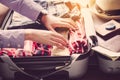 Tourists are packing luggage for travel.