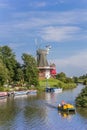 Tourists in a paddle boat on the river in Greetsiel