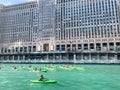 Tourists paddle in kayaks on the Chicago River in front of the Merchandise Mart Royalty Free Stock Photo