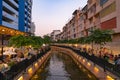 Tourists paddling a boat, canoe or kayak in Bangkok. Ong Ang Canal in Thailand. People lifestyle adventure activity recreation.