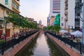 Tourists paddling a boat, canoe or kayak in Bangkok. Ong Ang Canal in Thailand. People lifestyle adventure activity recreation.