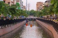 Tourists paddling a boat, canoe or kayak in Bangkok. Ong Ang Canal in Thailand. People lifestyle adventure activity recreation.