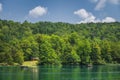 Tourists paddling in two paddleboats on lake in Plitvice Lakes Royalty Free Stock Photo