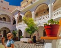 Tourists at Panormitis monastery interior yard