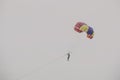 Tourists parasailing