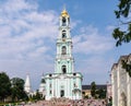 Tourists and parishioners around the bell tower. Holy Trinity-St. Sergiev Posad