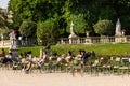 Tourists and Parisians relaxing in the Luxembourg Gardens. Paris