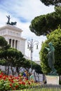 Tourists in park near the monument to Victor Emmanuel II Royalty Free Stock Photo