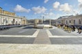 Tourists pass by a closed off barricaded section of St Peter`s Square at Vatican City Royalty Free Stock Photo