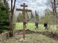 Dubrovo, Narofominsky district, Moscow region, Russia, May, 02, 2021. Tourists pass by the memorial cross on the site of the destr