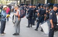 Tourists pass next to Police controls the access to international Sants rails station in Barcelona