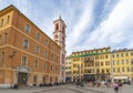 Tourists pass by the Rusca Palace at the Place du Palais du Justice in the Mediterranean city of Nice, France Royalty Free Stock Photo