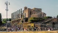 Tourists pass by The Temple of Venus and Roma