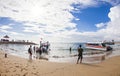 Tourists and passengers take a boat in the port of Sanur to go to Nusa Lembongan, a popular tourist destination in Bali