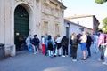 Tourists peeps into the keyhole of the Villa Magistrale dei Cavalieri di Malta.