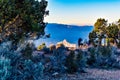 Tourists Peer Out Over the Edge of the South Rim of the Grand Canyon at the Desert View Overlook at Sunset in the Late Fall