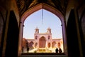 Tourists and persian locals in a multi-colored mosque Nasir al Mulk.