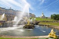 Tourists in Peterhof fountains of the Grand Cascade. Royalty Free Stock Photo