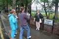 Tourists photograph each other in front of the street sign of Penny Lane. Liverpool, England. Royalty Free Stock Photo