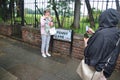 Tourists photograph each other in front of the street sign of Penny Lane. Liverpool, UK. Royalty Free Stock Photo