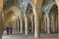 Tourists photograph interior of prayer hall in Vakil Mosque, Shiraz, Iran.