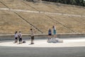 Tourists are photographed on the podium at the Panathenaic stadium Royalty Free Stock Photo