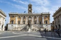 Tourists at Piazza del Campidoglio on top of Capitoline Hill and Palazzo Senatorio, Rome, Italy. Royalty Free Stock Photo