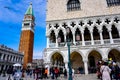 Tourists at the Piazza San Marco with St. Mark`s Campanile, The Lion of Venice and Doge`s Palace Palazzo Ducale in Venice Italy Royalty Free Stock Photo