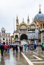 Tourists in Piazza San Marco St Marks Square. San Marco Basilica Patriarchal Cathedral of Saint Mark, Venice, Italy Royalty Free Stock Photo