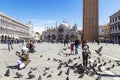 Tourists and pigeons in Piazza San Marco in Venice