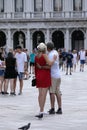 Tourists and pigeons in Venice, Italy Royalty Free Stock Photo