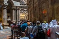 Tourists and pilgrims stand in line waiting to enter Jesus's empty tomb, where he is said to have been buried and resurrected in