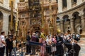 Tourists and pilgrims stand in line waiting to enter Jesus\'s empty tomb, where he is said to have been buried and resurrected in