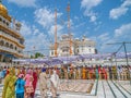 Tourists and pilgrims waiting in line at Golden Temple