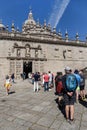 Tourists and pilgrims waiting in line to enter the Holy door of Santiago de
