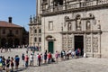 Tourists and pilgrims waiting in line to enter the Holy door of Santiago de